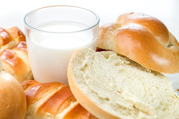 Breakfast, brunch, milk with homemade pastries on white background with flowers
