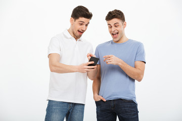 Portrait of two excited young men