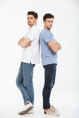 Full length portrait of two upset young men
