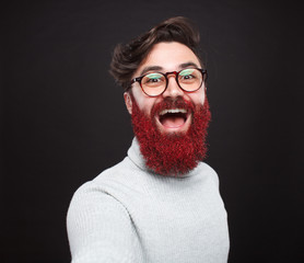 Excited crazy beaded man in glitters