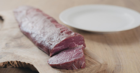 raw beef fillet for steak on wooden board