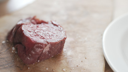 raw beef fillet for steak on wooden board