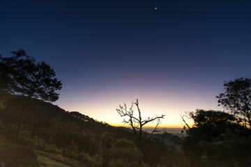 landscape of sunrise in the early morning twilight and moon on sky