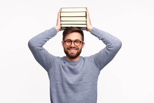 Smiling Diligent Student With Stack Of Books