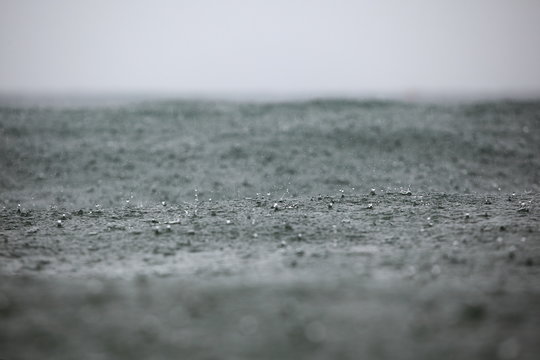 rain drops on the surface of the waves