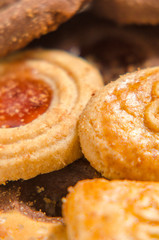 assorted cookies on wooden tray