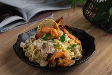 Pasta Tagliatelle with prawns and chanterelles mushrooms