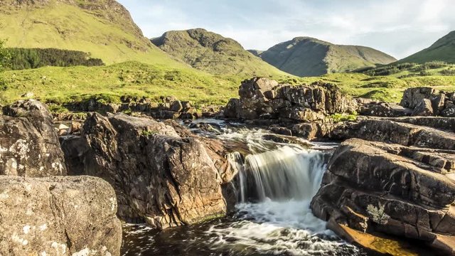 Dolly shot time lapse with long time exposure of the paradisal waterfall landscape in Glen Etive, Scotland - United Kingdom