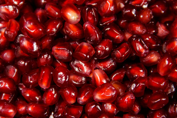 Food background of the fresh ripe pomegranate seeds