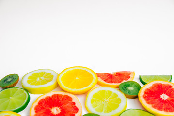 Summer fruit background with lime, lemon, orange, kiwi and grapefruit with space for text
