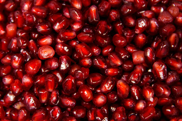Food background of the fresh ripe pomegranate seeds