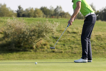 A golf player on a green