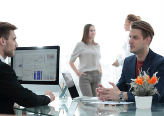 senior and junior businessman discuss something during their meeting