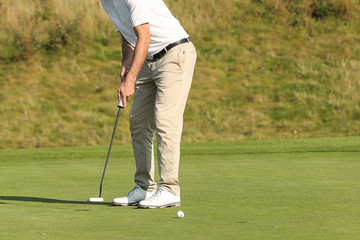A golf player on a green