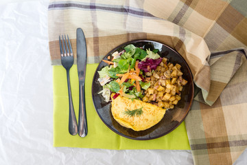 French Omelette with Potatoes, Mushroom and Salad