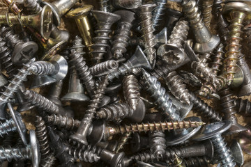 Pile of loose assorted sizes screws. Macro of pile of screws