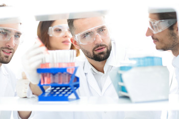 closeup of a group of scientists and pharmacists in the laboratory.