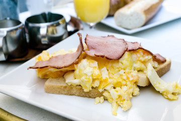 Breakfast with orange juice and fresh fruits on table