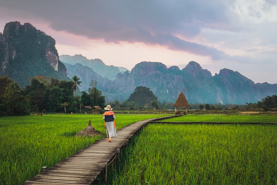 Woman walking at straw arbor