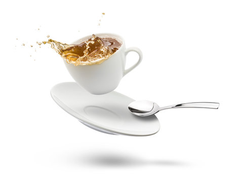 cup of tea with saucer flying and splashing, on white background