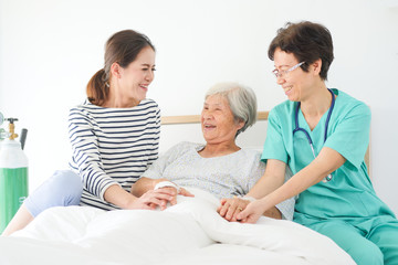 Asian old woman with daugther and doctor in the room  hospital in happy mood
