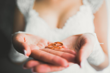 Luxury beautiful wedding rings in the hands