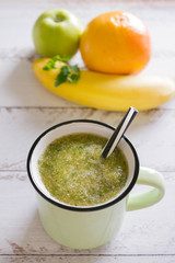  Healthy eating. Green apple, parsley, banana ,green smoothies , measuring tape. Dieting, slimming, weight loss and meal planning concept. Place for text