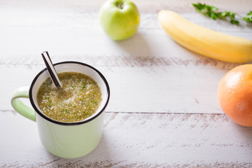  Healthy eating. Green apple, parsley, banana ,green smoothies , measuring tape. Dieting, slimming, weight loss and meal planning concept. Place for text