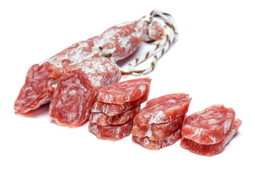 Dried organic salami sausage on white background