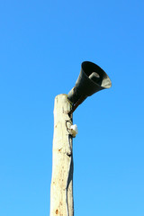 Horn Information carrier on a pole, sky background, Shooting from below
