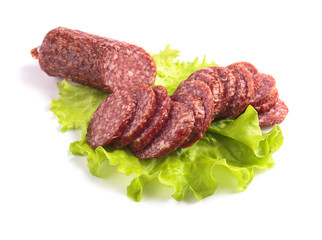 Slices of salami  isolated on  white .
