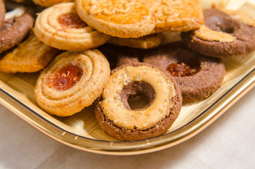 assorted cookies on wooden tray