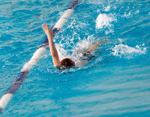 boy on a swim in a sports pool