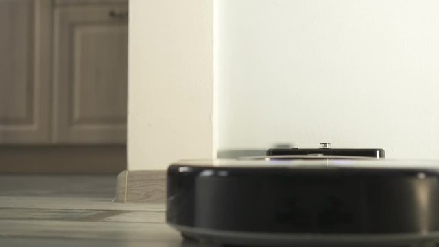 Automatic Vacuum Cleaning Robot coming to dock station for Self-Charging.