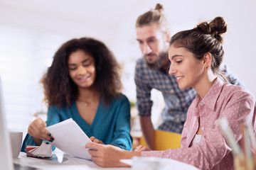 Multiracial business team working together around a laptop  