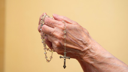 Close up of old woman hands praying. Concept hope and faith