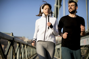 Young couple running in the morning