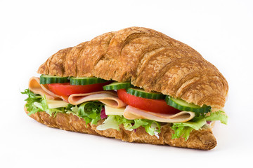 Croissant sandwich with cheese, ham and vegetables. Isolated on white background

