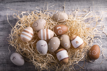 Easter eggs beige on the table