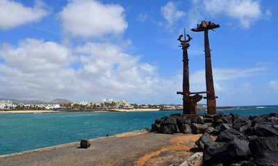 Costa Teguise Lanzarote with Large Pieces of public art in forground