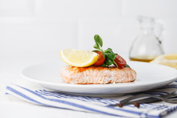 grilled salmon with cherry tomatoes and salad