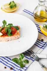 grilled salmon with cherry tomatoes and salad
