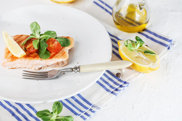 grilled salmon with cherry tomatoes and salad