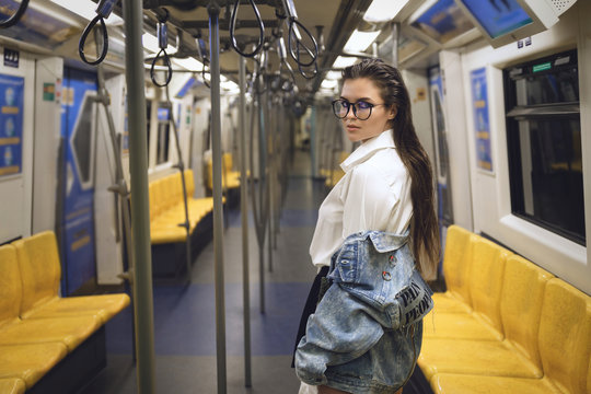 Sexy model is posing in carriage of metro train