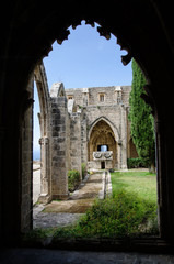 Fototapeta na wymiar Arch and columns at Bellapais Abbey. Kyrenia. Cyprus
