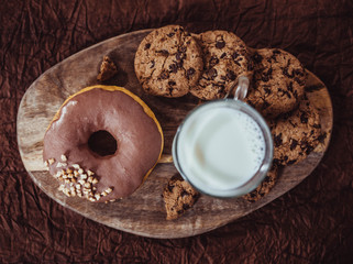 Colorful donuts on wooden table. Top view