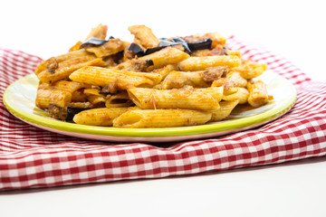 Spaghetti with aubergine and tomato sauce on a the table