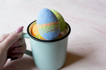 Easter egg in a cup. Beautiful easter background. Homemade holiday decor.	