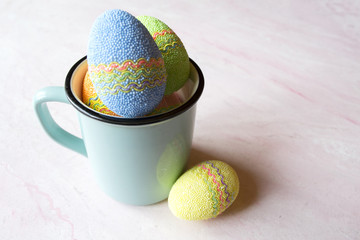 Easter egg in a cup. Beautiful easter background. Homemade holiday decor.	
