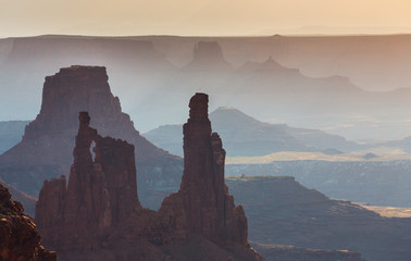 Beautiful Canyonlands view, from Mesa Arch, under warm surise light, on a clear autumn day